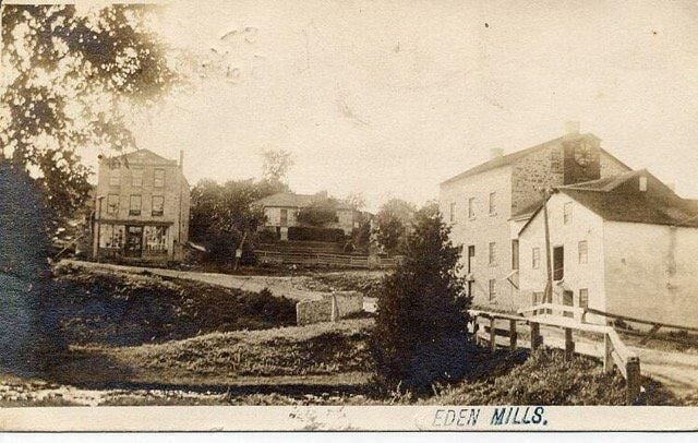 A historic sepia photograph of the village of Eden Mills, Ontario